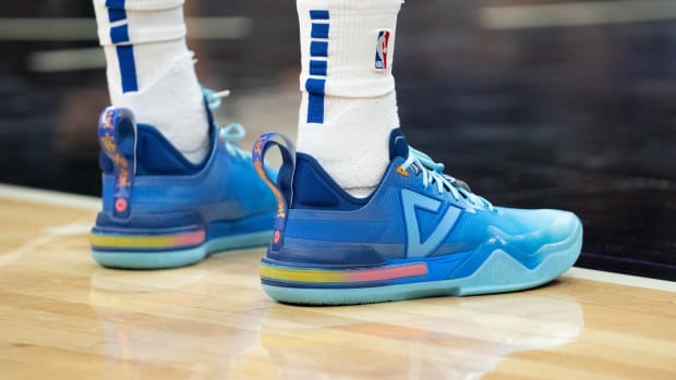 Side view of Andrew Wiggins' blue Peak sneakers.